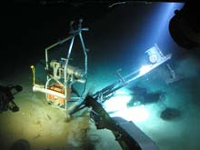 The bait deployment system on the EITS, known as the CLAM, is closed before it is recovered from the bottom. The bait deployment system on the EITS, known as the CLAM, is closed before it is recovered from the bottom.