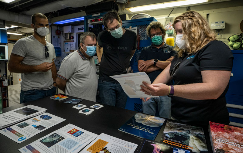 NOAA Ocean Exploration Operations Chief Kasey Cantwell talks with visitors to NOAA Ship Okeanos Explorer during ship tours conducted while the vessel was in port in Horta, Azores.
