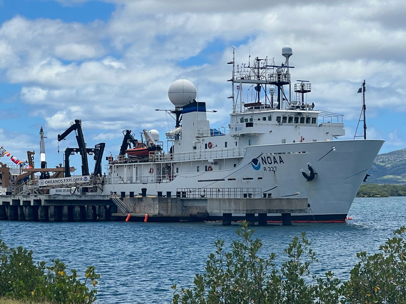 During in-port periods before and after the Beyond the Blue: Papahānaumokuākea Mapping 2 expedition, NOAA Ship Okeanos Explorer will be docked at the NOAA Daniel K. Inouye Regional Center on Oahu’s Ford Island, as it was in these images from June 2024.