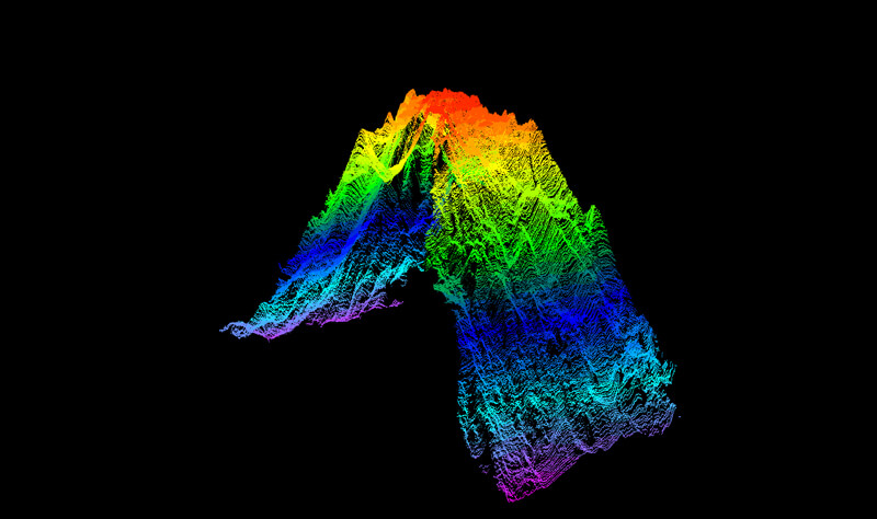 A point cloud of the seamount mapped during the Seascape Alaska 1: Aleutians Deepwater Mapping expedition, generated from acoustic data collected via multibeam echosounder. The hot colors (red, orange, and yellow) represent the newly mapped peak of the seamount at a depth of 895 meters (2,936 feet), while the cold colors (purple, teal, blue) represent the base of the seamount at a depth of around 4,000 meters (13,123 feet).